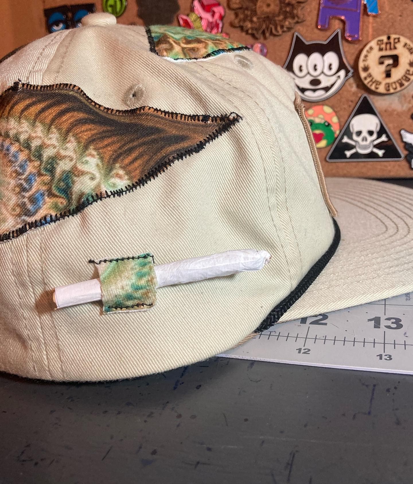 Chain-stitched moth patch on natural cotton.