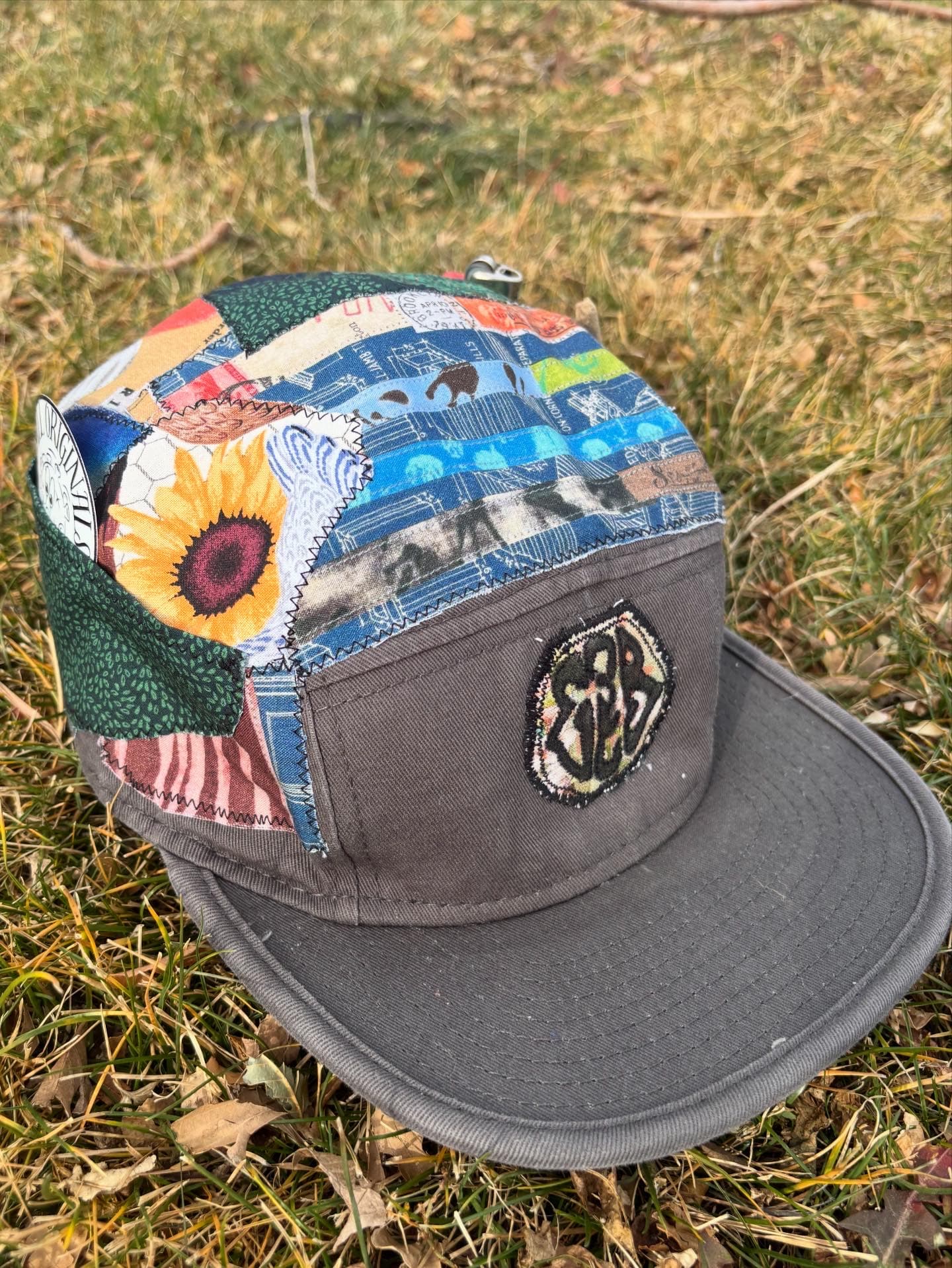 Brass keyring with hand-etched odd-mark.